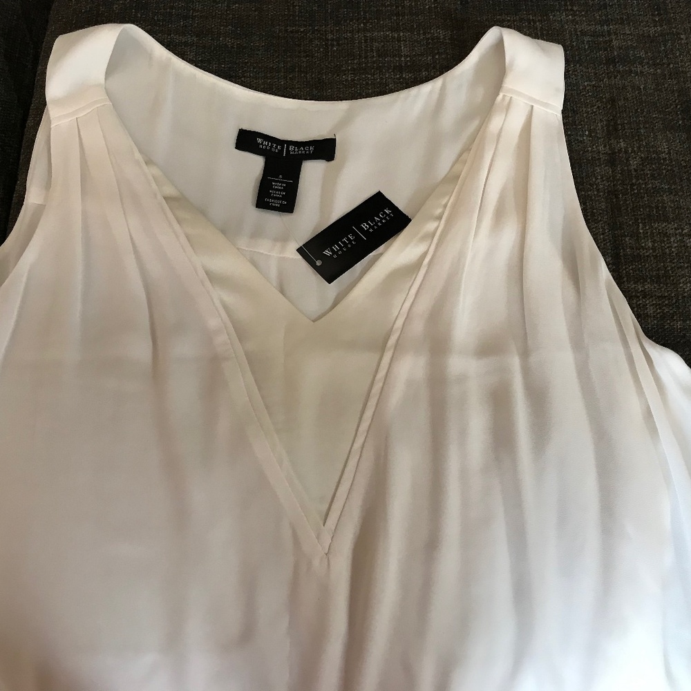 Sleeveless off white top